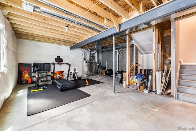 workout area featuring water heater and heating unit