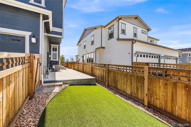 view of yard featuring a patio area and a fenced backyard