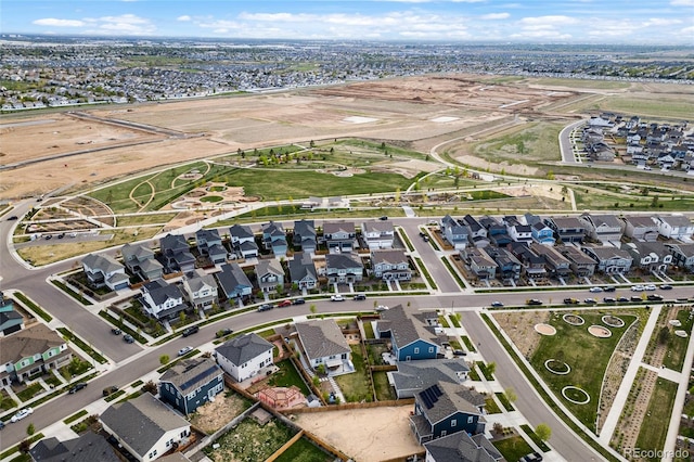 birds eye view of property with a residential view