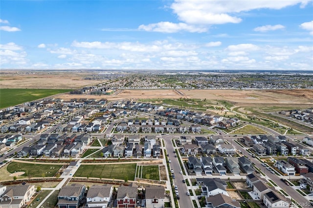 birds eye view of property with a residential view