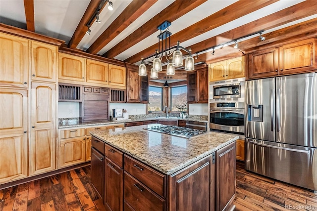 kitchen featuring dark wood-type flooring, track lighting, beam ceiling, and stainless steel appliances