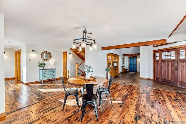 dining room with a chandelier, stairway, hardwood / wood-style floors, and baseboards