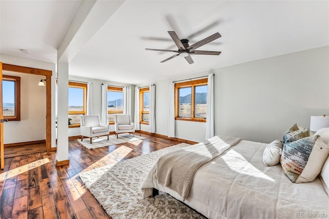 bedroom featuring hardwood / wood-style flooring and multiple windows