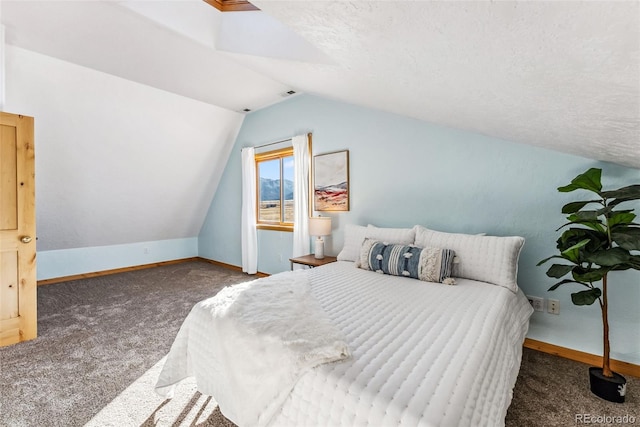 bedroom featuring baseboards, vaulted ceiling, and carpet