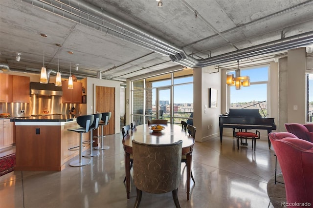 1610 Little Raven St Unit 502, Denver, CO 80202 - dining room with finished concrete flooring and baseboards
