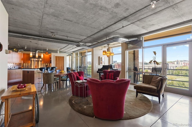 1610 Little Raven St Unit 502, Denver, CO 80202 - living area with concrete floors and plenty of natural light