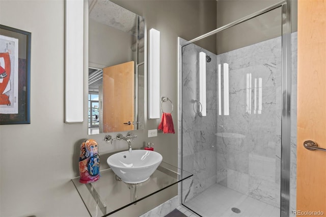 1610 Little Raven St Unit 502, Denver, CO 80202 - full bathroom featuring a marble finish shower and a sink
