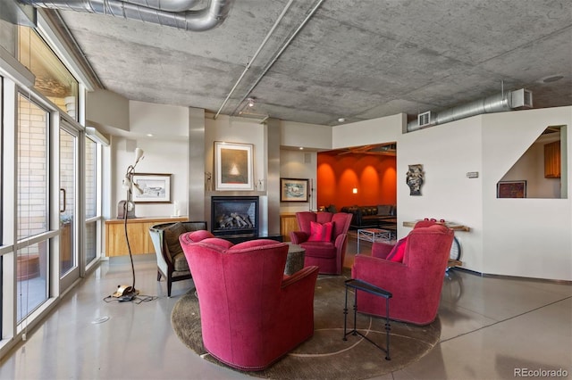 1610 Little Raven St Unit 502, Denver, CO 80202 - living room with finished concrete flooring and a glass covered fireplace