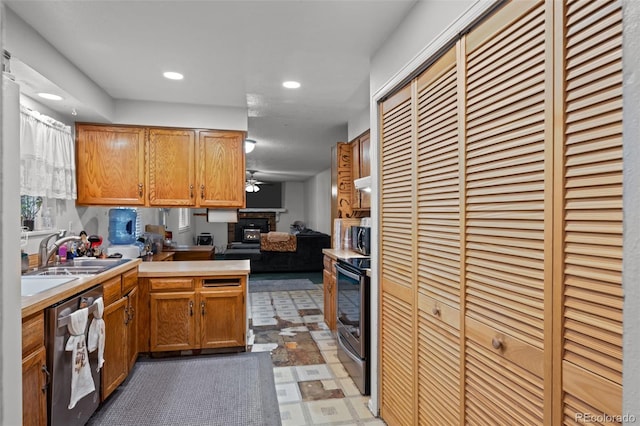 4550 E 121st Pl, Thornton, CO 80241 - kitchen featuring appliances with stainless steel finishes, a heating unit, a sink, a peninsula, and open floor plan