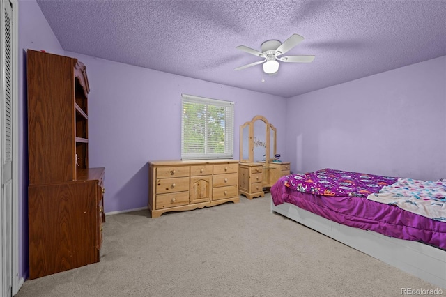 4550 E 121st Pl, Thornton, CO 80241 - bedroom featuring light colored carpet, a textured ceiling, and a ceiling fan