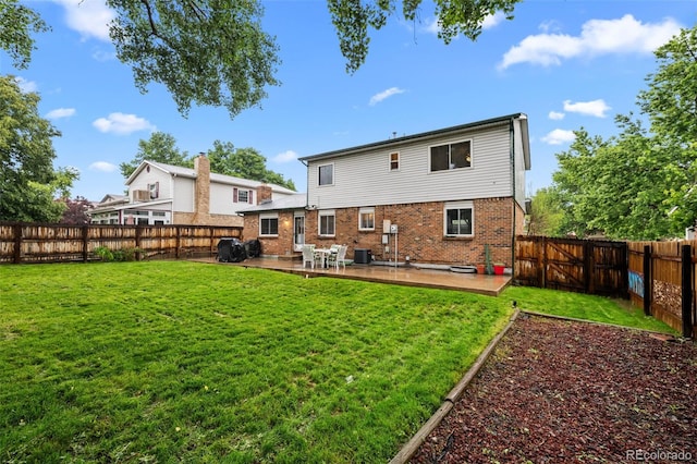 4550 E 121st Pl, Thornton, CO 80241 - rear view of house featuring brick siding, central AC unit, and a patio area