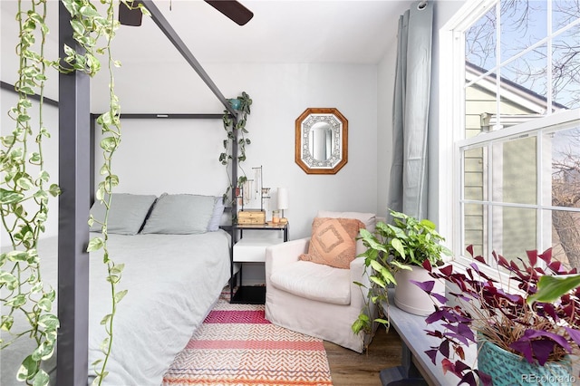 bedroom featuring wood finished floors and a ceiling fan