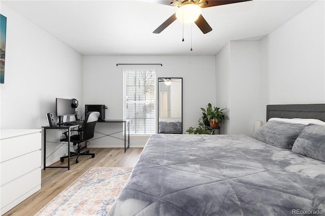 bedroom with light wood finished floors and ceiling fan