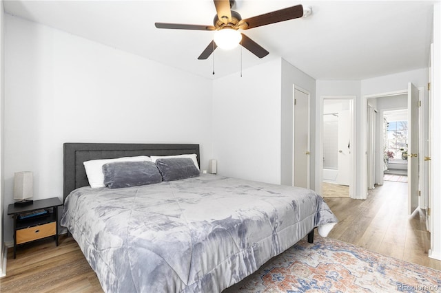 bedroom with ceiling fan and wood finished floors