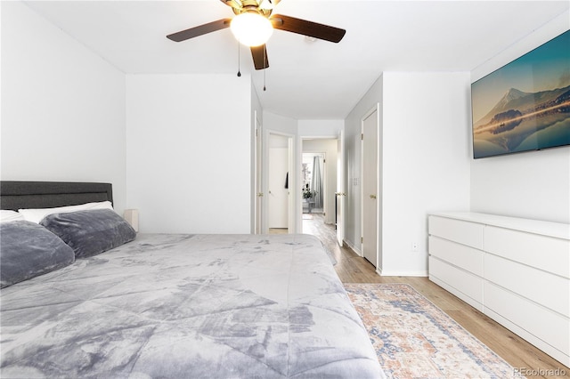 bedroom featuring light wood-type flooring and ceiling fan