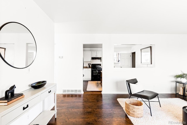 living area featuring dark hardwood / wood-style flooring