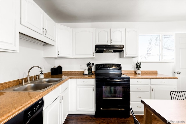 kitchen featuring sink, white cabinets, and black appliances