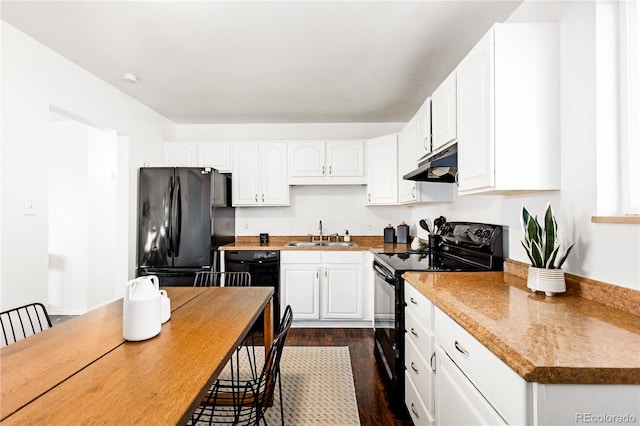 kitchen with sink, white cabinets, dark hardwood / wood-style flooring, and black appliances