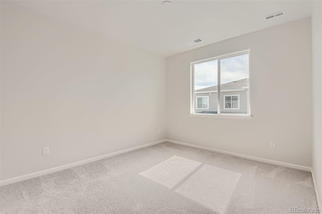 unfurnished room featuring carpet