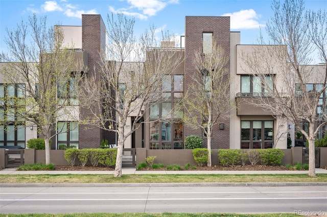 8071 E 29th Ave, Denver, CO 80238 - view of front facade with stucco siding and brick siding