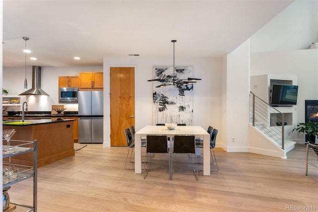 8071 E 29th Ave, Denver, CO 80238 - dining space featuring light wood-style floors, recessed lighting, and baseboards
