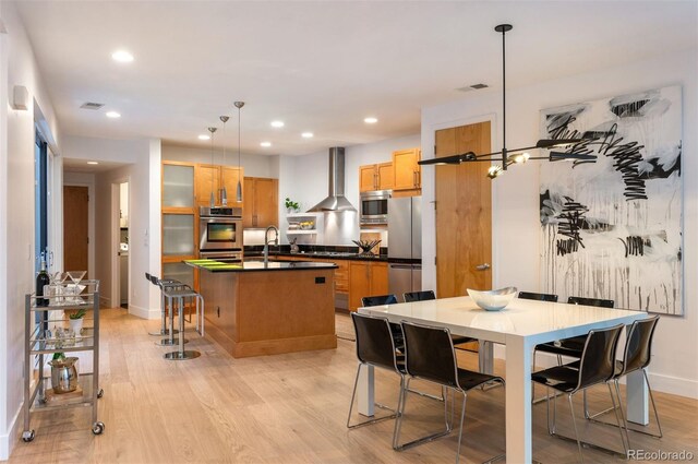 8071 E 29th Ave, Denver, CO 80238 - dining room featuring baseboards, light wood-style flooring, and recessed lighting