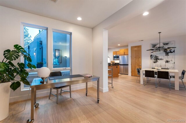 8071 E 29th Ave, Denver, CO 80238 - home office featuring light wood-style floors, baseboards, and recessed lighting