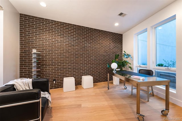 8071 E 29th Ave, Denver, CO 80238 - office featuring brick wall, wood finished floors, and recessed lighting