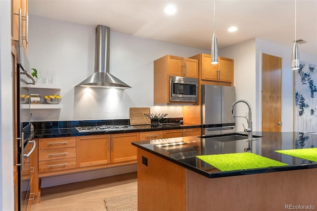 8071 E 29th Ave, Denver, CO 80238 - kitchen with wall chimney exhaust hood, stainless steel appliances, light wood-style floors, dark countertops, and recessed lighting
