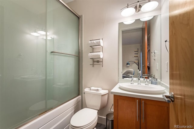 8071 E 29th Ave, Denver, CO 80238 - bathroom featuring toilet, vanity, and shower / bath combination with glass door