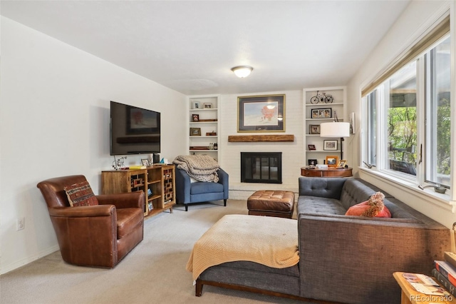 living room featuring a fireplace, light carpet, and built in shelves