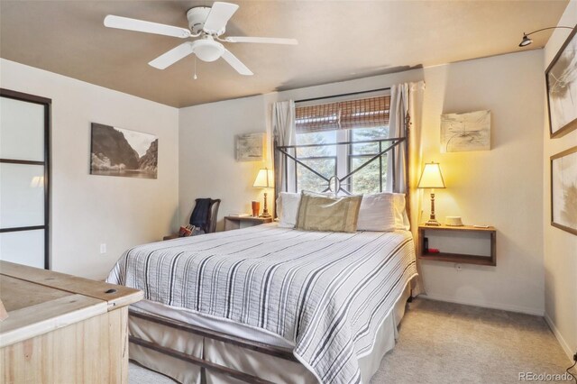 carpeted bedroom featuring ceiling fan