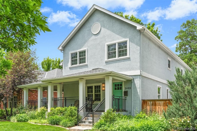 2485 S Fillmore St, Denver, CO 80210 - view of front of home with a porch and stucco siding
