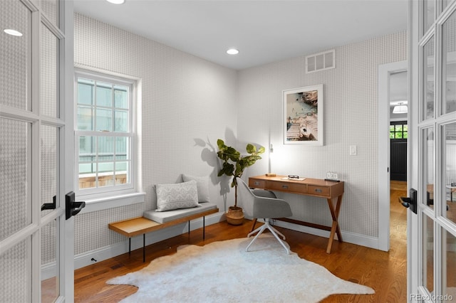 2485 S Fillmore St, Denver, CO 80210 - living area with baseboards, wood finished floors, wallpapered walls, french doors, and recessed lighting