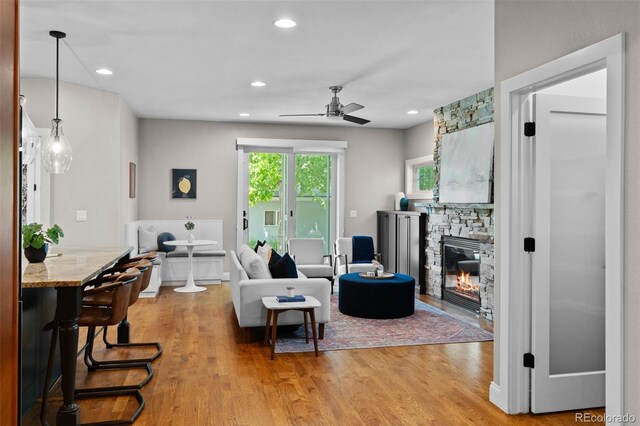 2485 S Fillmore St, Denver, CO 80210 - living area with ceiling fan, light wood-style flooring, a fireplace, and recessed lighting