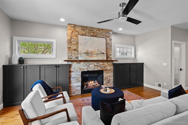 2485 S Fillmore St, Denver, CO 80210 - living room featuring wood finished floors, ceiling fan, baseboards, a fireplace, and recessed lighting