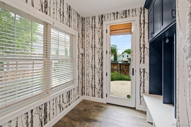 2485 S Fillmore St, Denver, CO 80210 - entryway with wallpapered walls, light wood-style floors, healthy amount of natural light, and baseboards