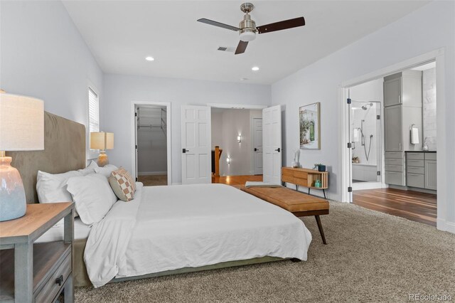 2485 S Fillmore St, Denver, CO 80210 - carpeted bedroom with a spacious closet, ensuite bath, a closet, recessed lighting, and ceiling fan