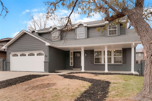 view of front of house featuring covered porch and a garage