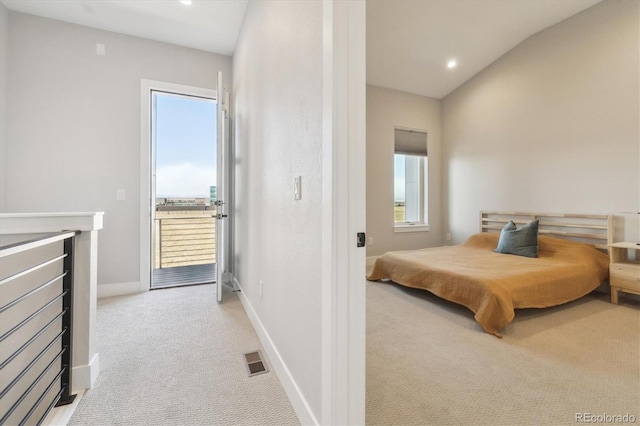 carpeted bedroom featuring access to outside