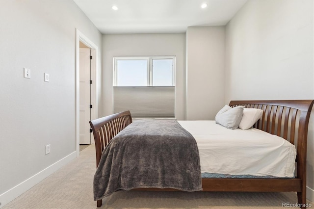 bedroom featuring light colored carpet