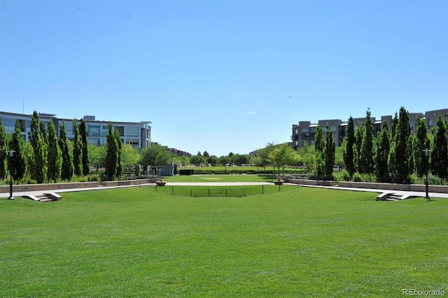 view of property's community with a lawn