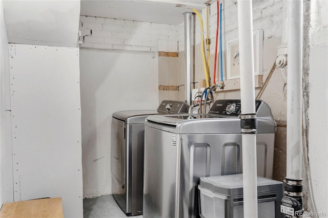 laundry area with washing machine and clothes dryer