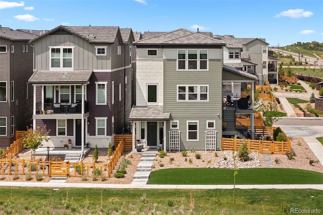 15020 Cast Pebble Cir, Parker, CO 80134 - view of front facade with a residential view, board and batten siding, and stairway