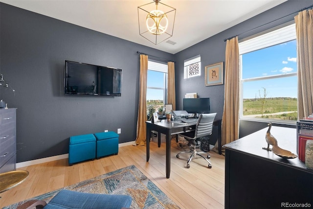 15020 Cast Pebble Cir, Parker, CO 80134 - office with light wood-style floors, baseboards, and a chandelier