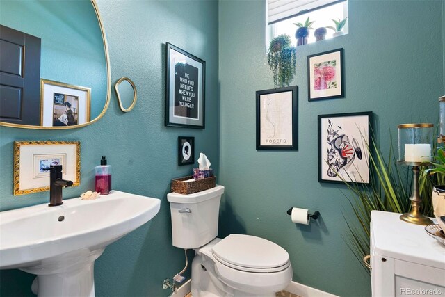15020 Cast Pebble Cir, Parker, CO 80134 - bathroom featuring a sink, toilet, and baseboards