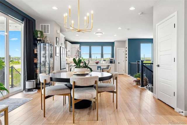 15020 Cast Pebble Cir, Parker, CO 80134 - dining area featuring a chandelier, plenty of natural light, light wood-type flooring, and recessed lighting