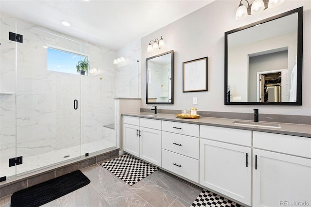 15020 Cast Pebble Cir, Parker, CO 80134 - bathroom featuring marble tiled flooring, double vanity, a marble finish shower, and recessed lighting