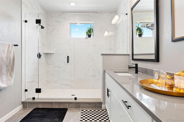 15020 Cast Pebble Cir, Parker, CO 80134 - full bathroom with plenty of natural light, a marble finish shower, double vanity, and baseboards