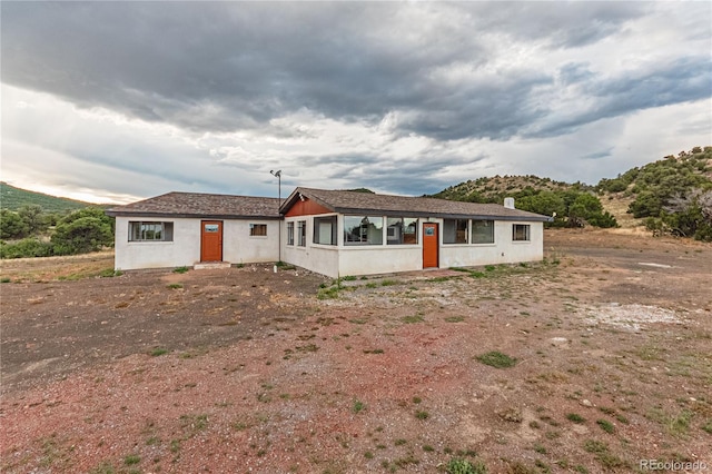 7727 County Road 521, Walsenburg, CO 81089 - single story home with stucco siding and entry steps